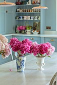PRIVATE GARDEN, DEDHAM VALE, SUFFOLK: KITCHEN, TABLE, REPRODUCTION OF A FRENCH MONASTERY TABLE, PEONIES, KITCHEN BY LOCAL COMPANY CHURCHILL BROTHERS, CERULLIAN BLUE, EDWARD BULMER