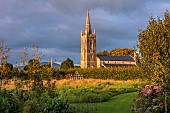 PATTHANA GARDEN, IRELAND: VIEW TO CHURCH, WILDFLOWER MEADOW, WICKLOW HILLS, GRASS PATH