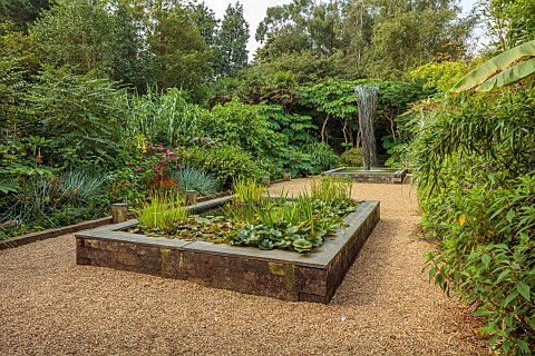 EAST_RUSTON_OLD_VICARAGE_GARDEN_NORFOLK_EXOTIC_GARDEN_TWO_RAISED_POOLS_PONDS_FOUNTAIN_BY_GILES_RAINE