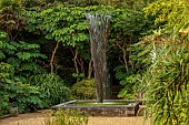 EAST RUSTON OLD VICARAGE GARDEN, NORFOLK: EXOTIC GARDEN, RAISED POOL, PONDS, FOUNTAIN BY GILES RAINER, EXOTIC BORDERS, TETRAPANAX PAPYRIFER REX, LEAVES, GREEN, FOLIAGE, AUGUST