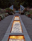 GRANTLEY HALL, YORKSHIRE: LIGHTING, DAWN, GRAVEL GARDEN, PATINATED STEEL AND COLOURED STAINLESS STEEL GLAZED CUPOLA SEAT AT END OF RILL, BORDERS, SEPTEMBER