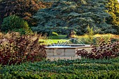 GRANTLEY HALL, YORKSHIRE: WATER FOUNTAIN, GRASSES, COTINUS, TREES, LAWN, SEPTEMBER