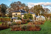 THE OLD VICARAGE, WORMINGFORD, ESSEX: DESIGNER JEREMY ALLEN: HOUSE, LAWN, BEDS OF SALVIA CARADONNA AND PURPLE MOORGRASS, MOLINIA CAERULEA EDITH DUDSZUS, NOVEMBER, FALL, AUTUMN