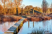 BECKLEY PARK, OXFORDSHIRE: FROST, FROSTY, WINTER, LAKE, WATER, STEPPING STONES MADE FROM ROBERT ADAM PLINTHS, ISLAND, TEMPLE, EIGHT STONE COLUMNS