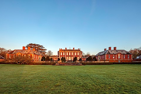 COTTESBROOKE_HALL_AND_GARDENS_NORTHAMPTONSHIRE_HALL_FROM_THE_SOUTH_LAWN_MARCH_SPRING_SUNRISE