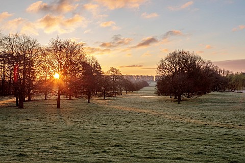 COTTESBROOKE_HALL_AND_GARDENS_NORTHAMPTONSHIRE_VIEW_FROM_SOUTH_TERRACE_SUNRISE_MARCH_SPRING_BORROWED