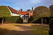COLUMBINE HALL, SUFFOLK: THE MAIN PATH, ENTRANCE TO THE HALL, HEDGES, GATE, MARCH