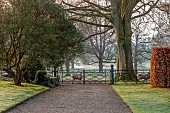 COTTESBROOKE HALL AND GARDENS, NORTHAMPTONSHIRE: MARCH, SPRING, SOUTH LAWN, PATH, GATES, SHEEP