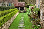 CAISSON GARDEN, SOMERSET: GREEN PATHS, WALL AND HEDGE BESIDE THE TENNIS COURT, HEDGES AT THE BACK OF THE HOUSE