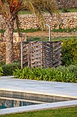 PRIVATE GARDEN ALARO, MALLORCA, DESIGNED BY MASHAMBA DESIGN: OUTDOOR SHOWER BESIDE SWIMMING POOL, APRIL