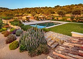 PRIVATE GARDEN ALARO, MALLORCA, DESIGNED BY MASHAMBA DESIGN: GRAVEL GARDEN, WALLS, SWIMMING POOL, CLIPPED TEUCRIUM FRUTICANS, ECHIUM CANDICANS