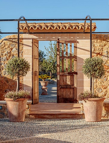 PRIVATE_GARDEN_ALARO_MALLORCA_DESIGNED_BY_MASHAMBA_DESIGN_ENTRANCE_TO_COURTYARD_WALL_GATE_TERRACOTTA