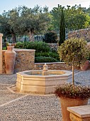 PRIVATE GARDEN ALARO, MALLORCA, DESIGNED BY MASHAMBA DESIGN: COURTYARD, FOUNTAIN, WALL, TERRACOTTA CONTAINERS, DECORATIVE COBBLED FLOOR