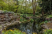 DODDINGTON PLACE, KENT: APRIL, SPRING, THE ROCK GARDEN, POOL, POND, QUARRY, ROCKS