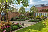 MORTON HALL GARDENS, WORCESTERSHIRE: APRIL, SPRING, BORDERS, TULIPS, SOUTH GARDEN, PYRUS SILVER SAILS, LAWN