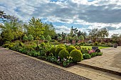 MORTON HALL GARDENS, WORCESTERSHIRE: APRIL, SPRING, BORDERS, TULIPS, SOUTH GARDEN, PYRUS SILVER SAILS, LAWN, BOX BALLS