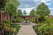 MORTON HALL GARDENS, WORCESTERSHIRE: APRIL, SPRING, BORDERS, TULIPS, SOUTH GARDEN, PYRUS SILVER SAILS, LAWN, PATHS, FOUNTAIN, WATER