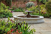 MORTON HALL GARDENS, WORCESTERSHIRE: APRIL, SPRING, BORDERS, TULIPS, SOUTH GARDEN, FOUNTAIN, WATER, PATH