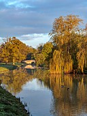 COTTESBROOKE HALL AND GARDENS, NORTHAMPTONSHIRE: SPRING, MARCH, LAKE, BRIDGE, REFLECTIONS, REFLECTED
