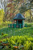 COTTESBROOKE HALL AND GARDENS, NORTHAMPTONSHIRE: SPRING, APRIL, THE WILD GARDEN, WOODEN SUMMERHOUSE, MATTEUCIA STRUTHIOPTERIS