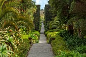 TRESCO ABBEY GARDEN, ISLES OF SCILLY: VIEW FROM TOP TERRACE ALONG NEPTUNE STEPS TO LIGHTHOUSE WALKS TO THE TRESCO CHILDREN SCULPTURE