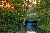 COTTESBROOKE HALL AND GARDENS, NORTHAMPTONSHIRE: SPRING, TREES, CASCADE, PARKLAND, SUNSET