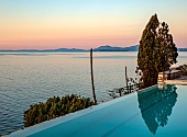KOULOURA, CORFU, GREECE: DESIGNER PAUL BANGAY: THE SWIMMING POOL, SUNRISE
