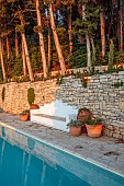 KOULOURA, CORFU, GREECE: DESIGNER PAUL BANGAY: THE SWIMMING POOL, SUNRISE, SEAT, BENCH, WALL