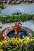 KOULOURA, CORFU, GREECE: DESIGNER PAUL BANGAY: CIRCULAR WATER FEATURE, TERRACOTTA CONTAINER, FOUNTAIN