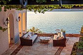 KOULOURA, CORFU, GREECE: DESIGNER PAUL BANGAY: SEA TERRACE, SEATS, TABLE, SUNRISE