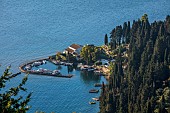 KOULOURA, CORFU, GREECE: DESIGNER PAUL BANGAY: LOOKING DOWN ON HARBOUR AND VILLA OF KOULOURA