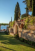 KOULOURA, CORFU, GREECE: DESIGNER PAUL BANGAY: LAWN, WALLS, FOUNTAIN, TERRACOTTA CONTAINERS