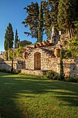 KOULOURA, CORFU, GREECE: DESIGNER PAUL BANGAY: LAWN, WALLS, FOUNTAIN, TERRACOTTA CONTAINERS