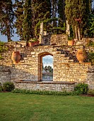 KOULOURA, CORFU, GREECE: DESIGNER PAUL BANGAY: WALLS, LAWN, TERRACES, TERRACOTTA CONTANERS, MIRROR FOUNTAIN, WATER FEATURE