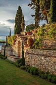 KOULOURA, CORFU, GREECE: DESIGNER PAUL BANGAY: WALLS, LAWN, TERRACES, TERRACOTTA CONTANERS, WATER FEATURE