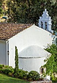 KOULOURA, CORFU, GREECE: DESIGNER PAUL BANGAY: LAWN, CHURCH