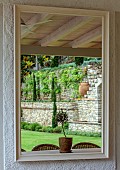 KOULOURA, CORFU, GREECE: DESIGNER PAUL BANGAY: MIRROR ON DINING TERRACE WALL