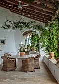 KOULOURA, CORFU, GREECE: DESIGNER PAUL BANGAY: COURTYARD, TERRACE, TABLE, CHIARS, ORCHID, MIRROR