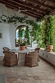 KOULOURA, CORFU, GREECE: DESIGNER PAUL BANGAY: COURTYARD, TERRACE, TABLE, CHIARS, ORCHID, MIRROR