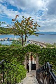 KOULOURA, CORFU, GREECE: DESIGNER PAUL BANGAY: STEPS, COURTYARD, GATE, HARBOUR