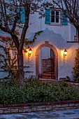 KOULOURA, CORFU, GREECE: DESIGNER PAUL BANGAY: OLD ARCHWAY, STAR JASMINE, TRACHELOSPERMUM JASMINOIDES, LIGHTING, LIGHTS