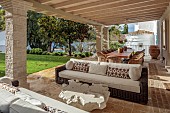 KOULOURA, CORFU, GREECE: DESIGNER PAUL BANGAY: OUTDOOR LIVING, SETTEES, TABLE, DINING TABLE, PERGOLA, LAWN, DINING TERRACE