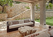 KOULOURA, CORFU, GREECE: DESIGNER PAUL BANGAY: OUTDOOR LIVING, SETTEES, TABLE, WALLS, STEPS, VINE, PERGOLA, LAWN