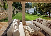 KOULOURA, CORFU, GREECE: DESIGNER PAUL BANGAY: OUTDOOR LIVING, SETTEES, TABLE, WALLS, LAWN