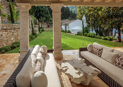 KOULOURA_CORFU_GREECE_DESIGNER_PAUL_BANGAY_OUTDOOR_LIVING_SETTEES_TABLE_WALLS_LAWN