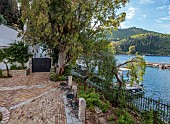 KOULOURA, CORFU, GREECE: DESIGNER PAUL BANGAY: CHURCH, FRONT GATE AND HARBOUR