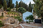 KOULOURA, CORFU, GREECE: DESIGNER PAUL BANGAY: COURTYARD, TERRACE, COURTYARD, WALLS, TERRACOTTA CONTAINERS, CHURCH