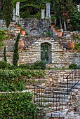 KOULOURA, CORFU, GREECE: DESIGNER PAUL BANGAY: COURTYARD, TERRACE, COURTYARD, WALLS, TERRACOTTA CONTAINERS, STAR JASMINE, TRACHELOSPERMUM JASMINOIDES, STEPS