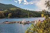 KOULOURA, CORFU, GREECE: DESIGNER PAUL BANGAY: THE HARBOUR SEEN FROM THE COURTYARD