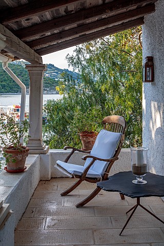 KOULOURA_CORFU_GREECE_DESIGNER_PAUL_BANGAY_CHAIR_AND_TABLE_ON_TERRACE